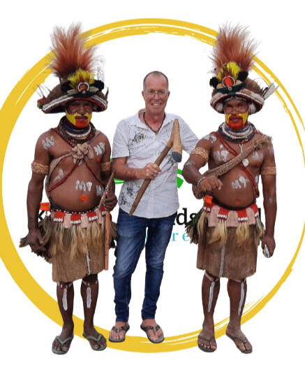 Ed Brumit , CEO of Kerema Friends Enterprises Inc A picture of the CEO of Kerema Friends Enterprises Inc (center) with two men entirely dressed up in the Huli/Hela (Tari) traditional attire.